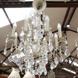 A large distressed wrought-metal 8-branch chandelier, with glass drops, branch length 27cm,