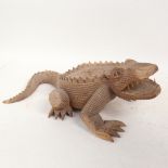 An African carved hardwood crocodile sculpture, length 40cm