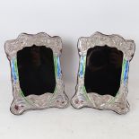 A pair of Art Nouveau style Continental silver and enamel-fronted strut photo frames, overall height