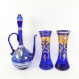 A large gilded and painted Bristol blue glass ewer and matching pair of vases, ewer height 49cm (3)