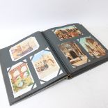 A Vintage postcard album, with various topographical cards, including France and Italy