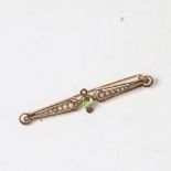 An early 20th century unmarked gold peridot and split-pearl brooch, length 5.5cm, 2.6g