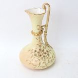 A Royal Worcester China Works ivory porcelain ewer, painted and gilded floral decoration, height