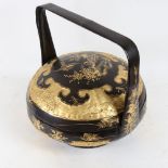 A Chinese lacquered and gilded bentwood food carrier and cover, bird fish and flower decoration,