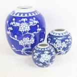 3 graduated Chinese blue and white Prunus pattern ginger jars, largest height 25cm (3)
