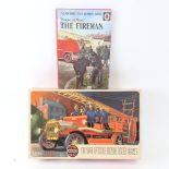A Vintage Airfix 1914 fire engine scale kit model, and a Vintage Ladybird People at Work The Fireman