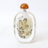 A large Chinese reverse painted glass snuff bottle, landscape scene with character marks, height