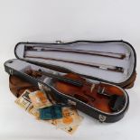 A 20th century half-size violin, with 2 bows, and hardshell carrying case