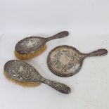 2 silver-backed dressing table hair brushes, and a silver hand mirror (3)