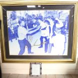 A large scale photographic print of Muhammad Ali with The Beatles, signed in pen by Ali, overall