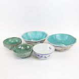 A pair of Chinese bowls with floral decoration, 17cm across, a signed blue and white bowl on foot, a