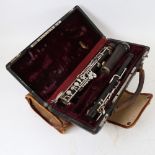 An Antique rosewood 3-piece oboe, by J Pontier of Paris, in original fitted case