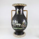 A large black ground ceramic 2-handled urn vase, enamelled chariot scenes, height 60cm, stapled