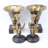 A pair of Art Deco style vase garnitures on marble bases, and a pair of turned wood and brass-