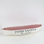 A large painted wood ship's hull shop advertising sign, "Pond Yachts For Sale Here", L77cm, D25cm,
