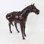 A Vintage leather-covered model horse, length 48cm, height 41cm