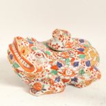 A large Oriental Imari style ceramic toad/frog, with baby toad stopper and allover floral