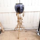 A gold painted wrought-iron jardiniere stand, with blue glazed jardiniere, stand height 86cm