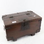 A small scale stained oak table-top metal-bound trunk, W40cm, H23cm, D26cm