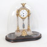 A Vintage silvered and gilded 4 pillar mantel clock, with pendulum and key, under glass dome with