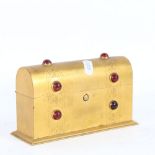 A small Gothic gilt-brass stone set dome-top stationery box, with engraved decoration, W17cm,
