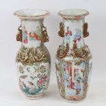 A near pair of Chinese Canton famille rose baluster vases, with gilt dragon mounts, height 25cm,