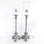 A graduated pair of distressed resin Corinthian column table lamps, largest height excluding fitting