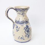 An Antique Dutch Delft tin-glaze earthenware jug, blue and white sailing and floral decoration,
