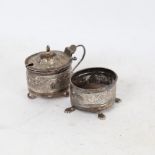 An early 20th century Indian unmarked silver 2-piece cruet set, comprising mustard pot and salt