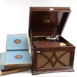 A cased HMV gramophone, and 4 albums of Vintage vinyl LPs