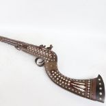 A 19th century Middle Eastern flintlock camel rifle, with allover mother-of-pearl inlaid decoration,