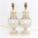A pair of Dresden gilded white porcelain urn table lamps, height excluding fitting 13cm