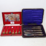 A cased set of 6 silver-gilt anointing spoons, and a set of 6 silver-handled butter knives
