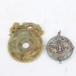 A Chinese Archaic style jade disc amulet, and a similar white metal mounted turquoise dragon
