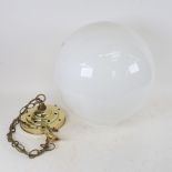 A large opaque milk glass and brass ceiling light fitting, shade diameter approx 35cm