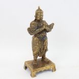 A Chinese bronze praying deity figure, Zhuan Shu script 4 character mark, height 23cm