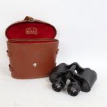 A pair of Rolex 8x30 binoculars, serial no. 15637, in original fitted leather case