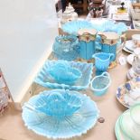 A group of blue milk glass, including baskets, fruit bowls etc