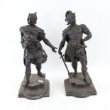 A pair of black painted spelter figural sculptures, knights in armour, height 38cm