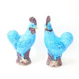 A pair of Chinese turquoise glaze pottery cockerel figures, height 20cm