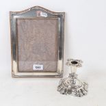 An unmarked silver rectangular photo frame, and a Danish silver squat candlestick (2)