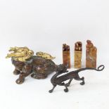 A patinated bronze seated Kylin, carved soapstone seals etc (5)