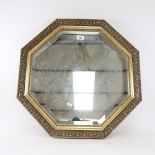An octagonal gilt-framed bevel-edge wall mirror, width 60cm