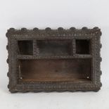 A heavy Indian carved hardwood desk stand, allover chip carved and fluted decoration, 38cm x 28cm