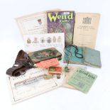 Various military cap badges, receipt books, Weird Tales magazine, belt etc (boxful)