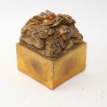 A large heavy Chinese bronze stone set dragon seal, with character mark base, width 7.5cm, height