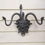 A bronze wall-mounted Medusa mask coat hanger, width 34cm
