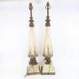 A large pair of painted and gilded ceramic tapered table lamps, height excluding fitting 77cm