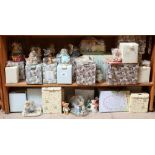 A large group of Enesco Cherished Teddies composition bear figurines, some boxed