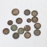 A group of miniature silver coins, including Maundy money